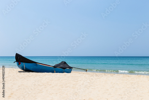 Wooden boat on the beach, travel to asia, tropical island, empty clean beach in summer seson