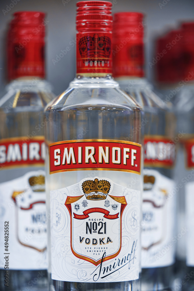 Russian vodka. Bottles of Smirnoff vodka on a shelf in duty free shop in  Dubai Airport. Traditional Russian souvenir. 12,02,2022, Dubai, UAE Photos  | Adobe Stock