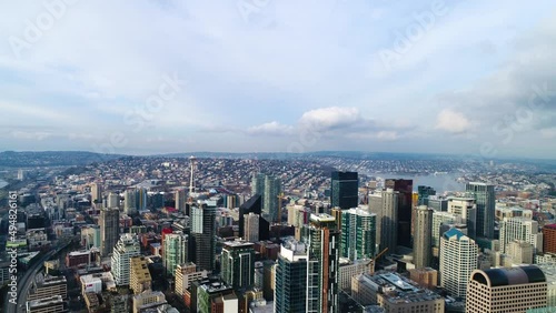 Wide aerial overtop the Seattle skyscrapers showing buildings as far as the horizon. photo