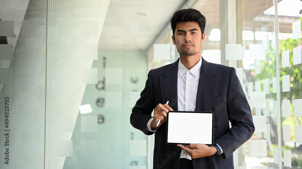 Asian businessman or male executive manager showing tablet screen mockup. Asian businessman or male executive manager showing tablet screen mockup.