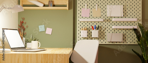 Modern minimal workspace in college dorm apartment with laptop mockup