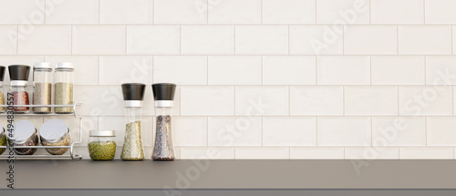 Фотография Set of spice bottles or seasoning bottles and copy space on kitchen countertop