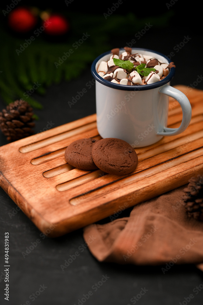 Delicious hot chocolate with marshmallow and cookies on wooden tray Delicious hot chocolate with marshmallow and cookies on wooden tray