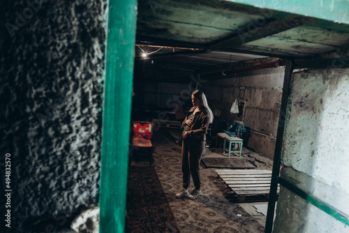War in Ukraine. A Ukrainian pregnant woman hides in a bomb shelter while resisting a Russian invasion.