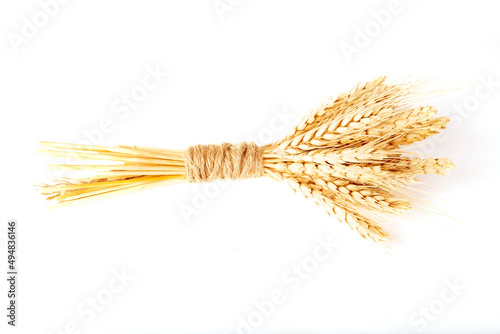 Sheaf of wheat ears isolated on white background.