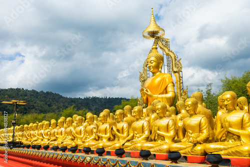 Canvas Print Lot of Golden Statue of Buddha sitting in meditation Belief Faith and Worship concept