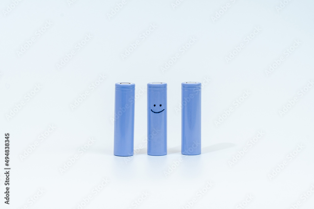Energy battery 18650 with smiley isolated on white background