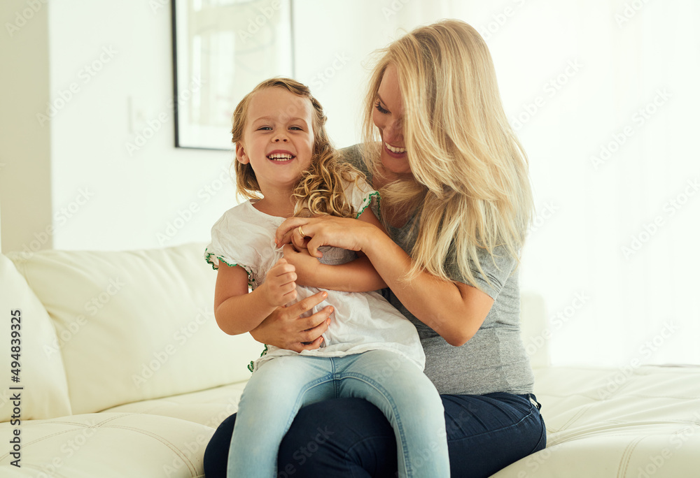 She might outgrow my lap but never my heart. Shot of a little girl sitting on her mothers lap at home. She might outgrow my lap but never my heart. Shot of a little girl sitting on her mothers lap at home.