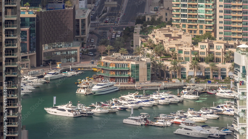 Aerial view on yachts floating in harbor timelapse.