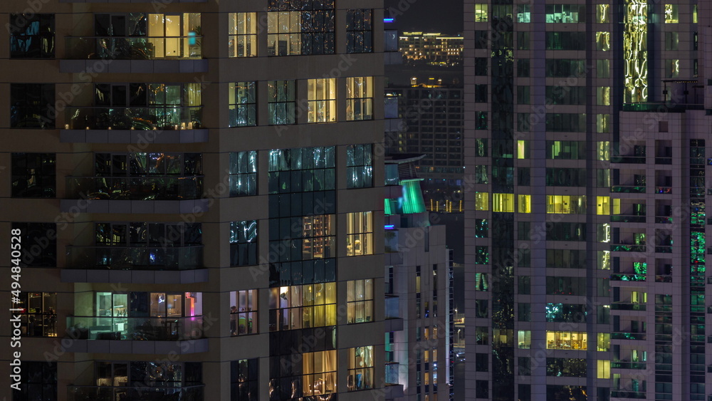 Evening view of exterior apartment recidential building timelapse with glowing windows Evening view of exterior apartment recidential building timelapse with glowing windows