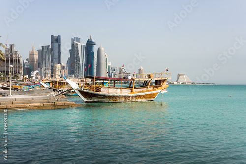 The traditional dhow on background of modern skyscrapers in the centre of Doha