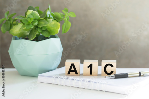 A1C text on wooden cubes on an office desk, medical concept