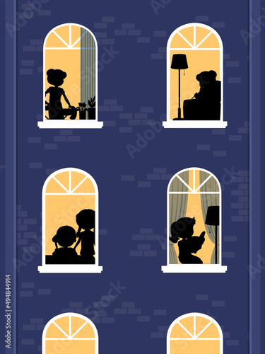 Night windows building with people silhouettes