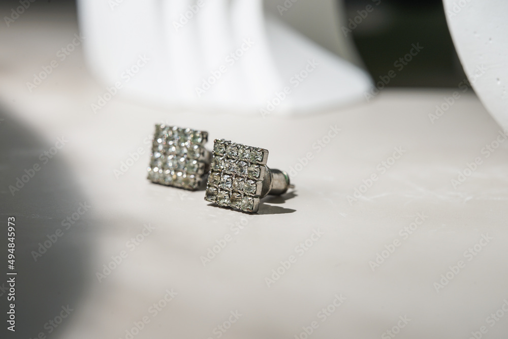 beautiful diamond earrings. Close-up of white diamond earrings.
beautiful diamond earrings. Close-up of white diamond earrings.
