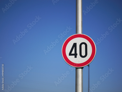 Speed Limit Sign 40 against the blue sky