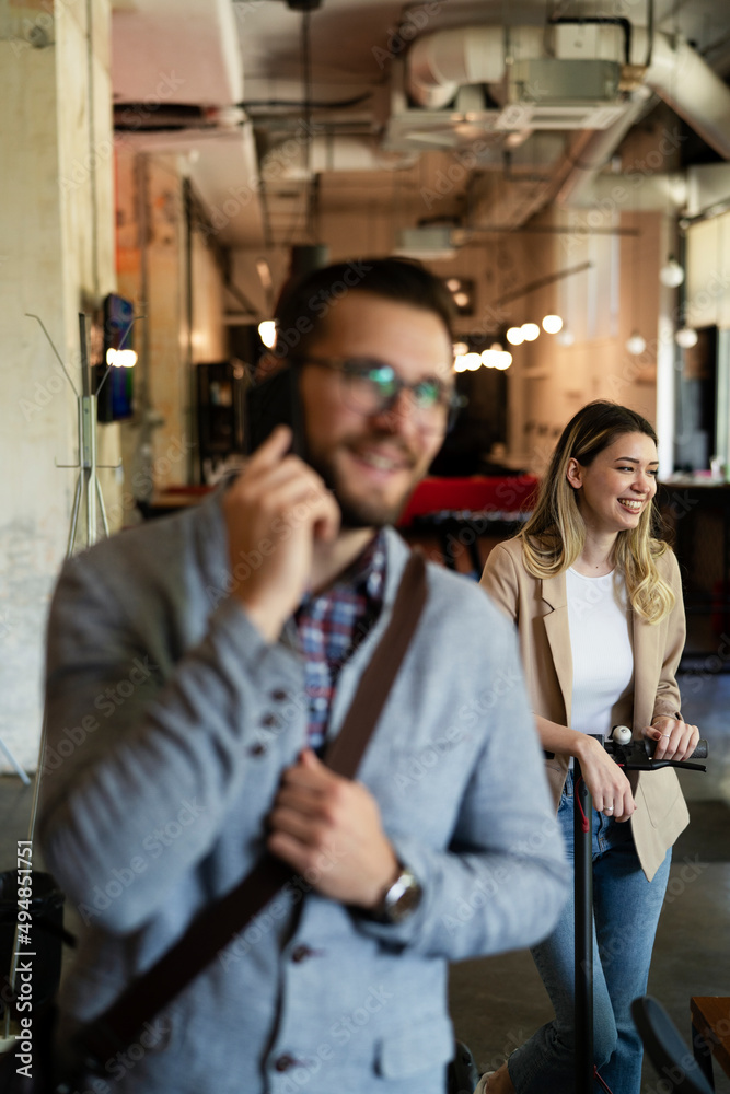 Businessman in office. Handsome businessman talking to the phone Businessman in office. Handsome businessman talking to the phone