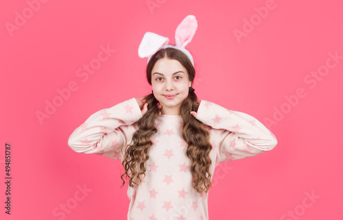 happy easter teen girl in bunny rabbit ears and pajamas, easter