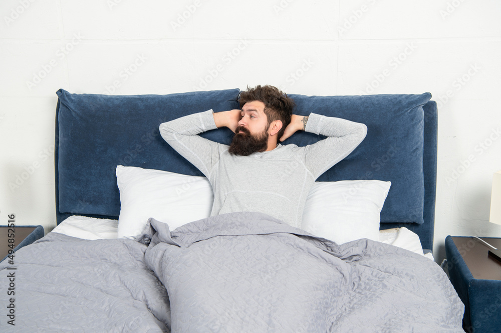 Drowsy guy being in bed awake after sleep, morning Drowsy guy being in bed awake after sleep, morning