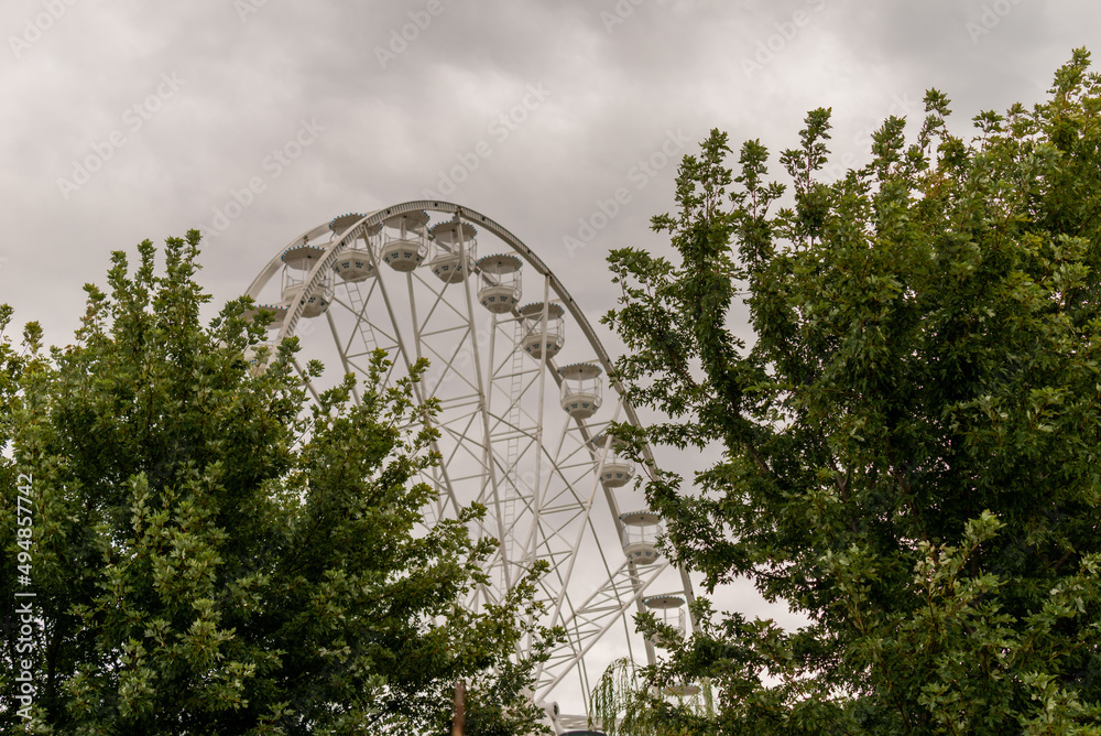 Ferris Wheel in Siofok, Balaton Lake, Hungary. Cloudy sky as background. Ferris Wheel in Siofok, Balaton Lake, Hungary. Cloudy sky as background.