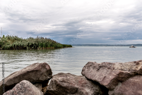 Balaton Lake shore in Hungary. Cloudy sky as background.