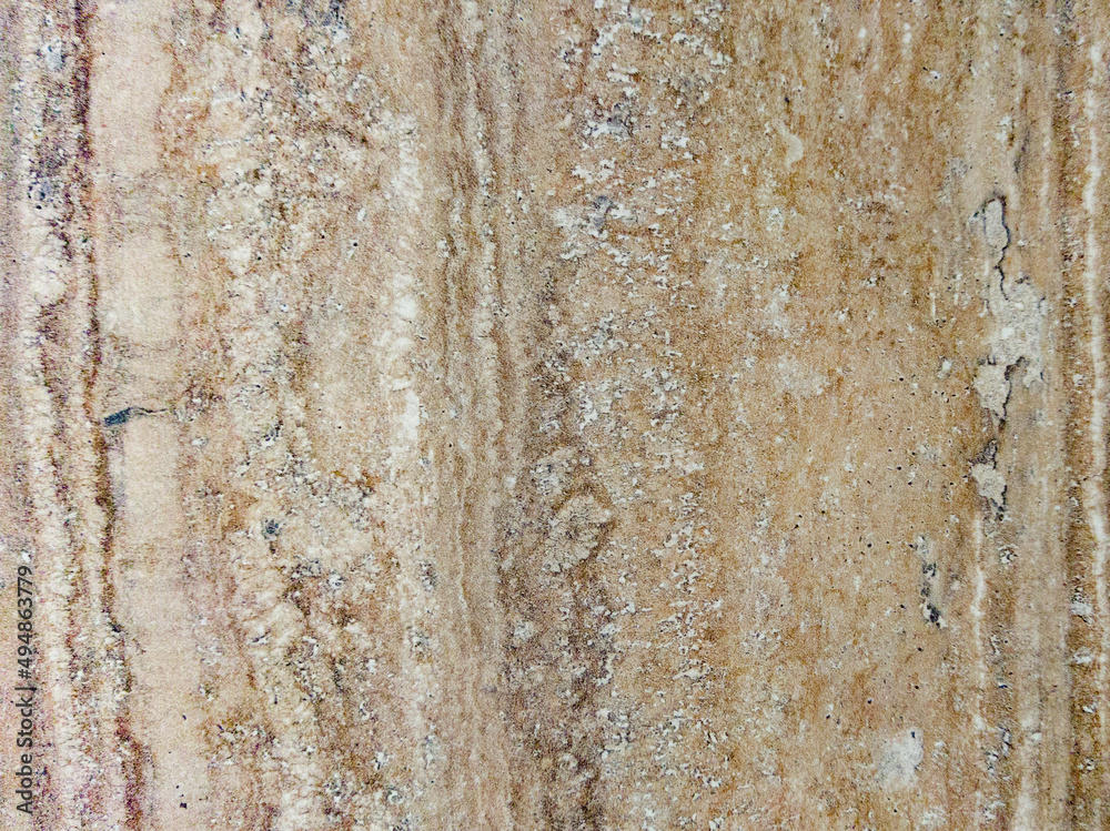 Brown background with vertical pattern. An old, worn brown wall with texture. Brown background with vertical pattern. An old, worn brown wall with texture.