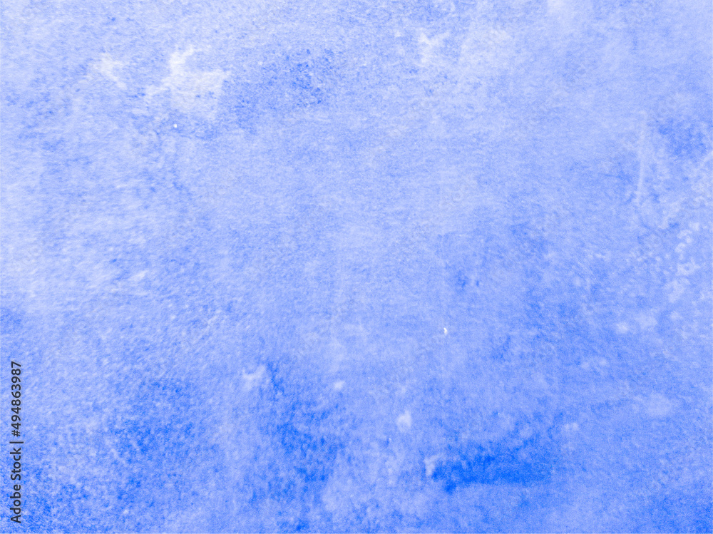 The smooth concrete wall is blue with spots. Blue background with texture. Worn surface.
