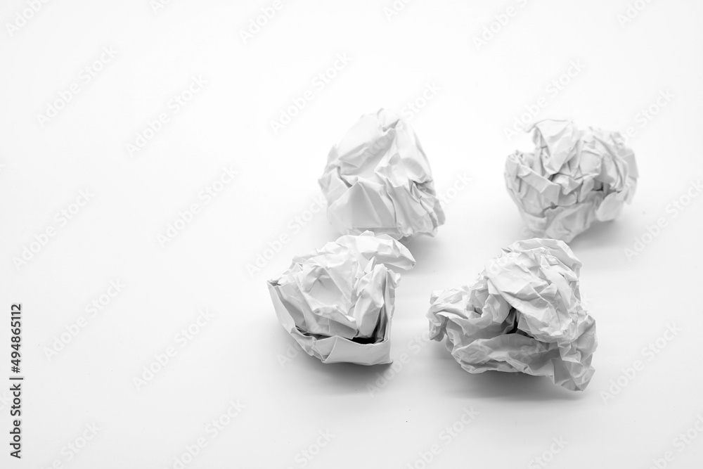 crumpled paper on white table brainstorming in the office concept                 