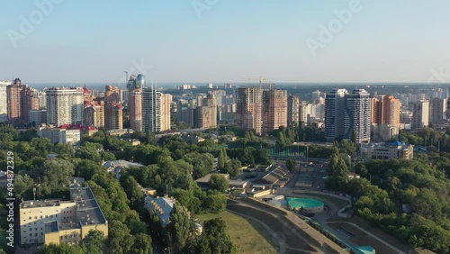 Aerial drone video of downtown skyline buildings in Kyiv Ukraine during sunset. Overlooking Olympiyskiy Stadium, filmed in August 2021 photo