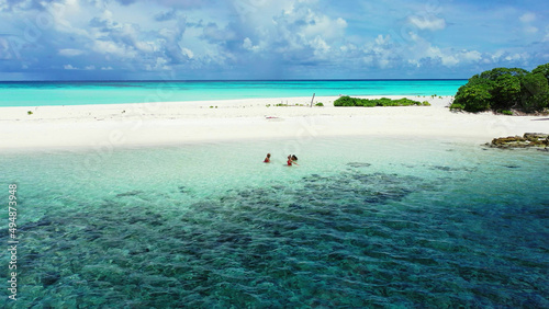 Caucasian women from Russia on the beach in Fulhadhoo Island, the Maldives photo