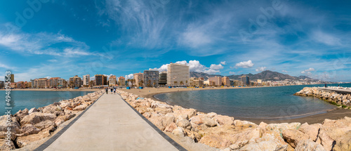 Panoramic view of Fuengirola city. View of promenade area of the city, Los Boliches Beach and San Francisco Beach. People walking to the promenade and pier area photo