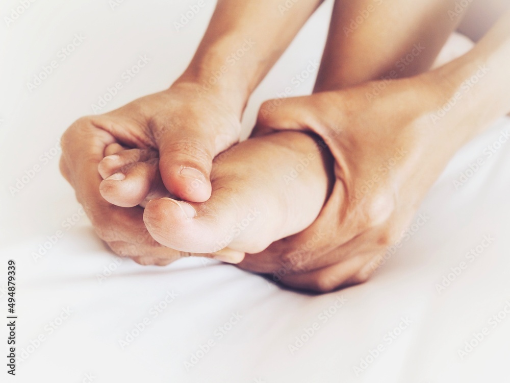 foot pain use hand massage to relieve pain and relax the foot muscle foot pain use hand massage to relieve pain and relax the foot muscle