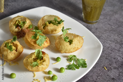 Selective Focus Picture of a North Indian Snack called Pani Puri with Background Blur photo