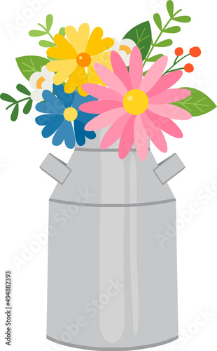 Spring flowers in tin milk jug