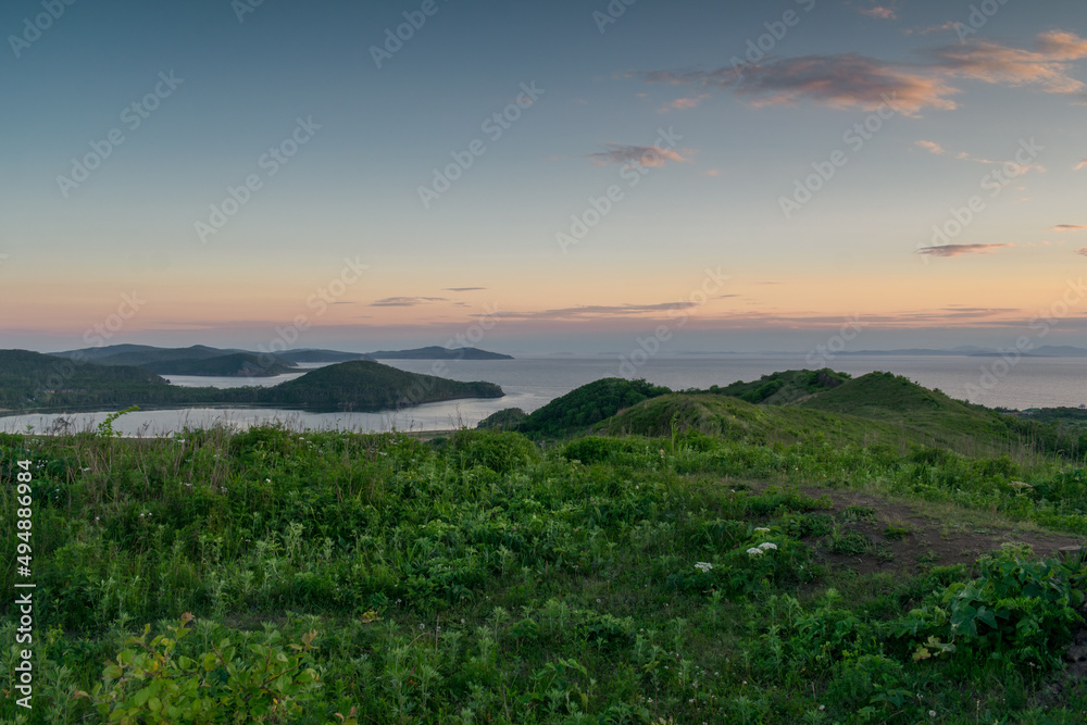Obraz premium Landscape with sea and green hills