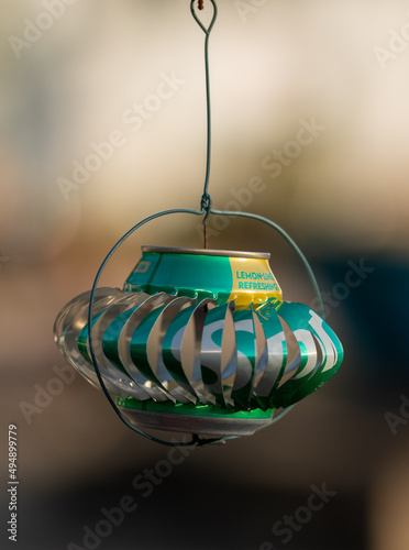 Tin can reused as lantern or decoration