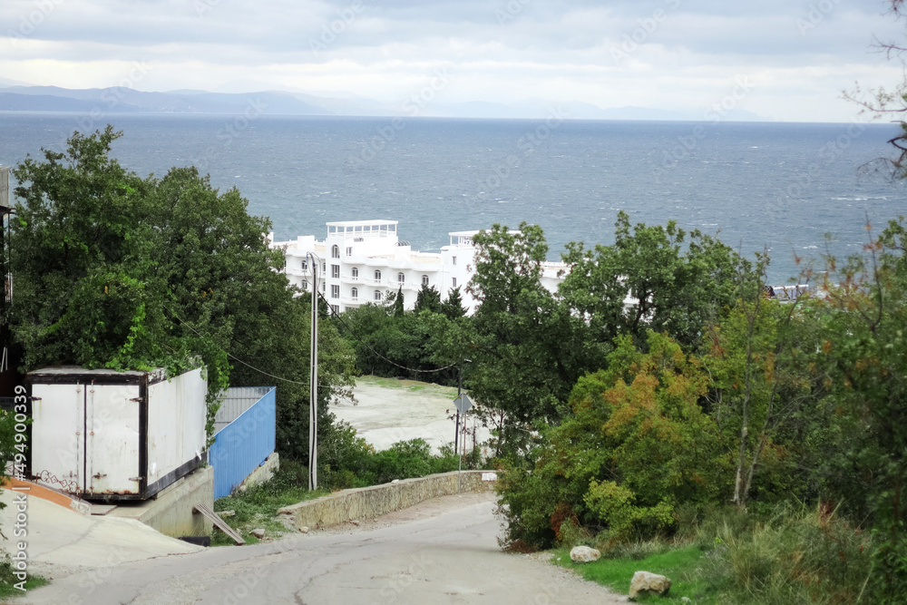 Panoramic view of the sea coast. Hotels and inns by the sea, tourist season. Republic of Crimea, Black Sea. Holidays in the South