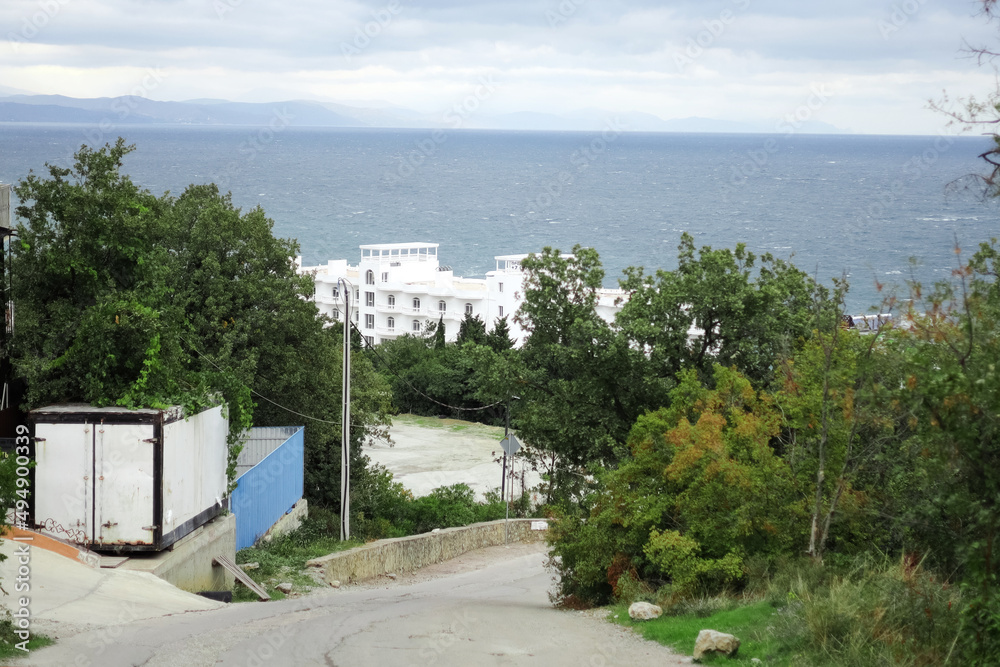 Panoramic view of the sea coast. Hotels and inns by the sea, tourist season. Republic of Crimea, Black Sea. Holidays in the South Panoramic view of the sea coast. Hotels and inns by the sea, tourist season. Republic of Crimea, Black Sea. Holidays in the South