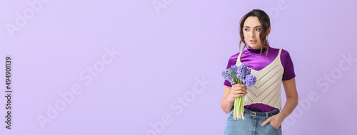 Pretty young woman holding bouquet of hyacinth flowers on lilac background with space for text