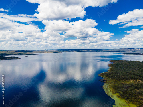 Fototapeta Naklejka Na Ścianę i Meble -  View at Copeton Dam Waters with the small lake and beautiful blue sky in Australia