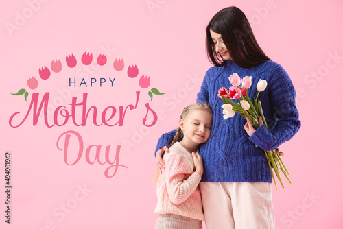 Young woman with bouquet of...