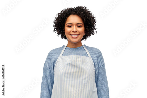 Fototapeta cooking, culinary and people concept - happy smiling woman in apron over white b