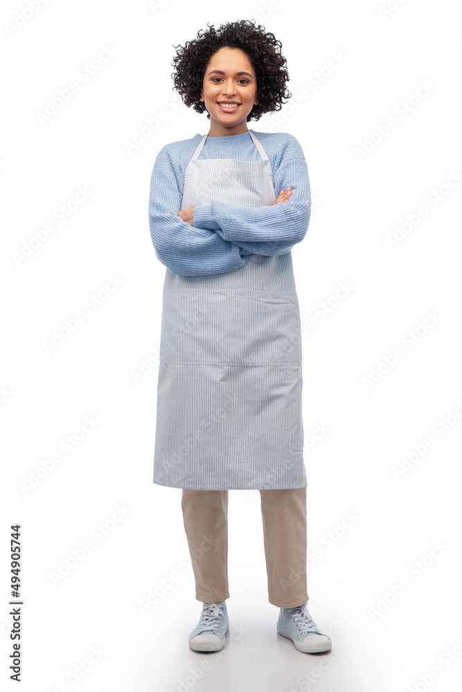 cooking, culinary and people concept - happy smiling woman in apron over white background