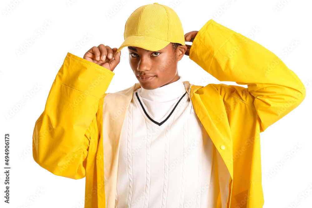 Handsome stylish African-American guy in raincoat on white background Handsome stylish African-American guy in raincoat on white background