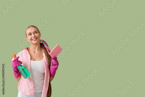 Young woman with sponge and...