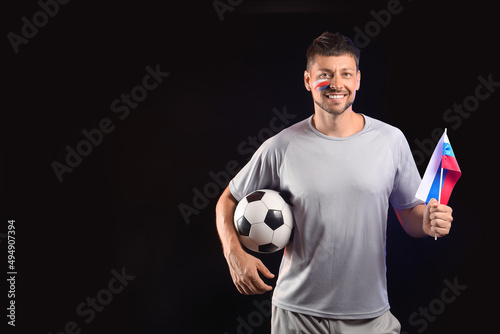 Football fan with ball and ...