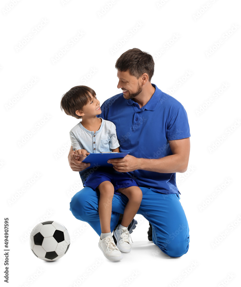 Male trainer with little boy and soccer ball on white background Male trainer with little boy and soccer ball on white background