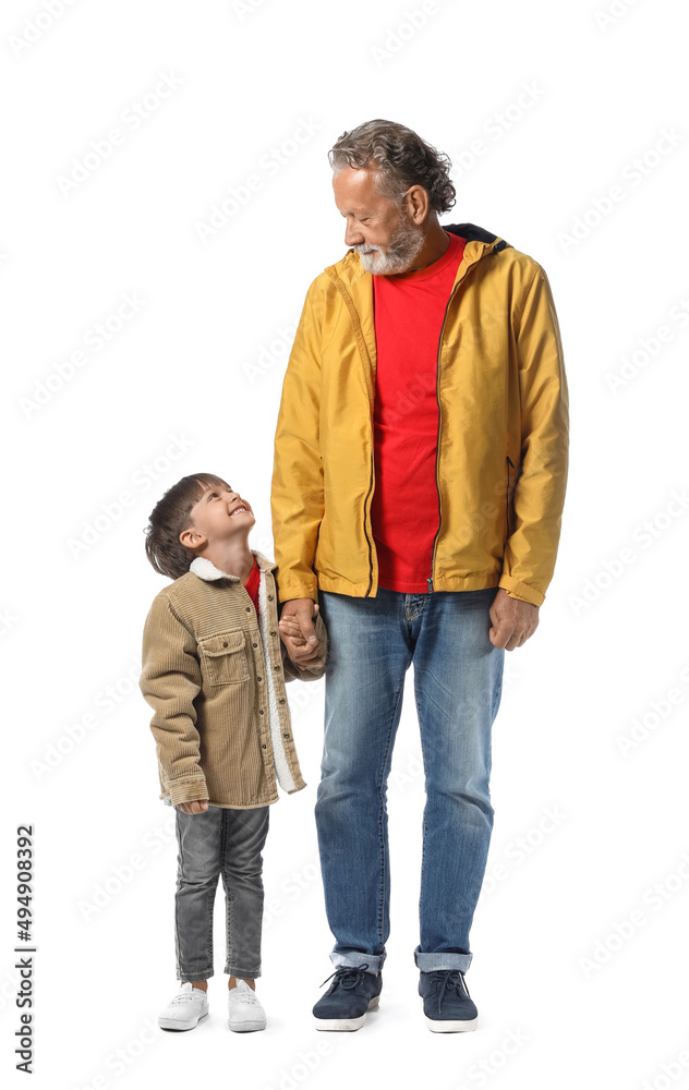 Little boy and his grandfather in warm jackets on white background Little boy and his grandfather in warm jackets on white background