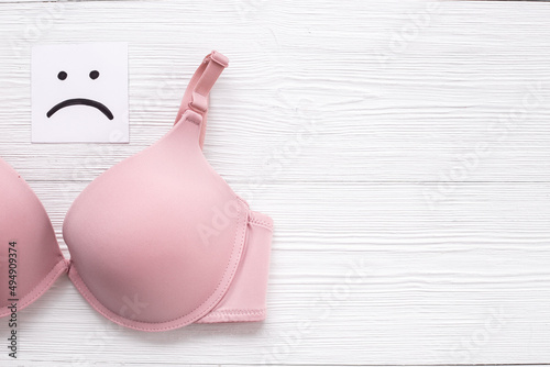 Pink bra top view - breast cancer diagnosis concept
