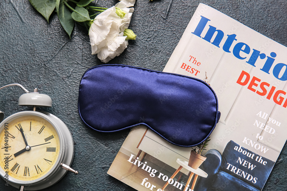 Sleep mask, alarm clock and magazine on dark background Stock-Foto | Adobe  Stock