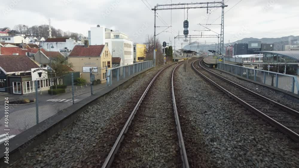 Driver seat view from inside passenger train arriving at Sandnes station - Sortoget along sorlandsbanen railway Norway Driver seat view from inside passenger train arriving at Sandnes station - Sortoget along sorlandsbanen railway Norway